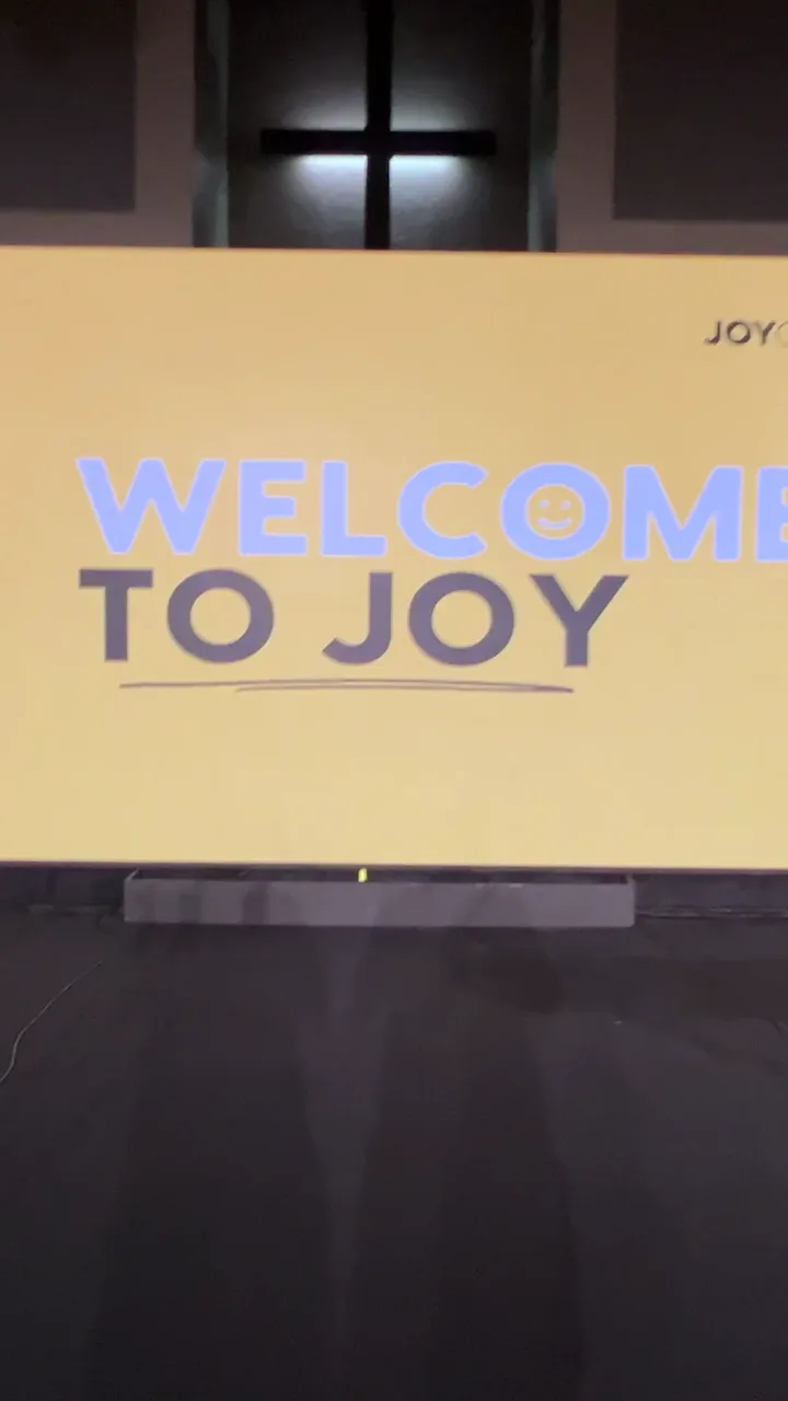 Completed Joy Church LED wall displaying welcome content beneath the sanctuary cross