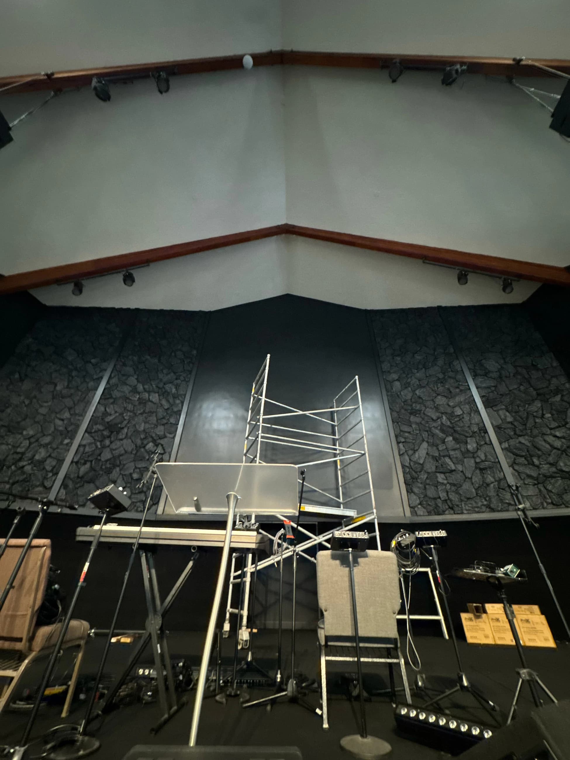 Encounter Church stage before the LED wall installation, with the original black center wall visible