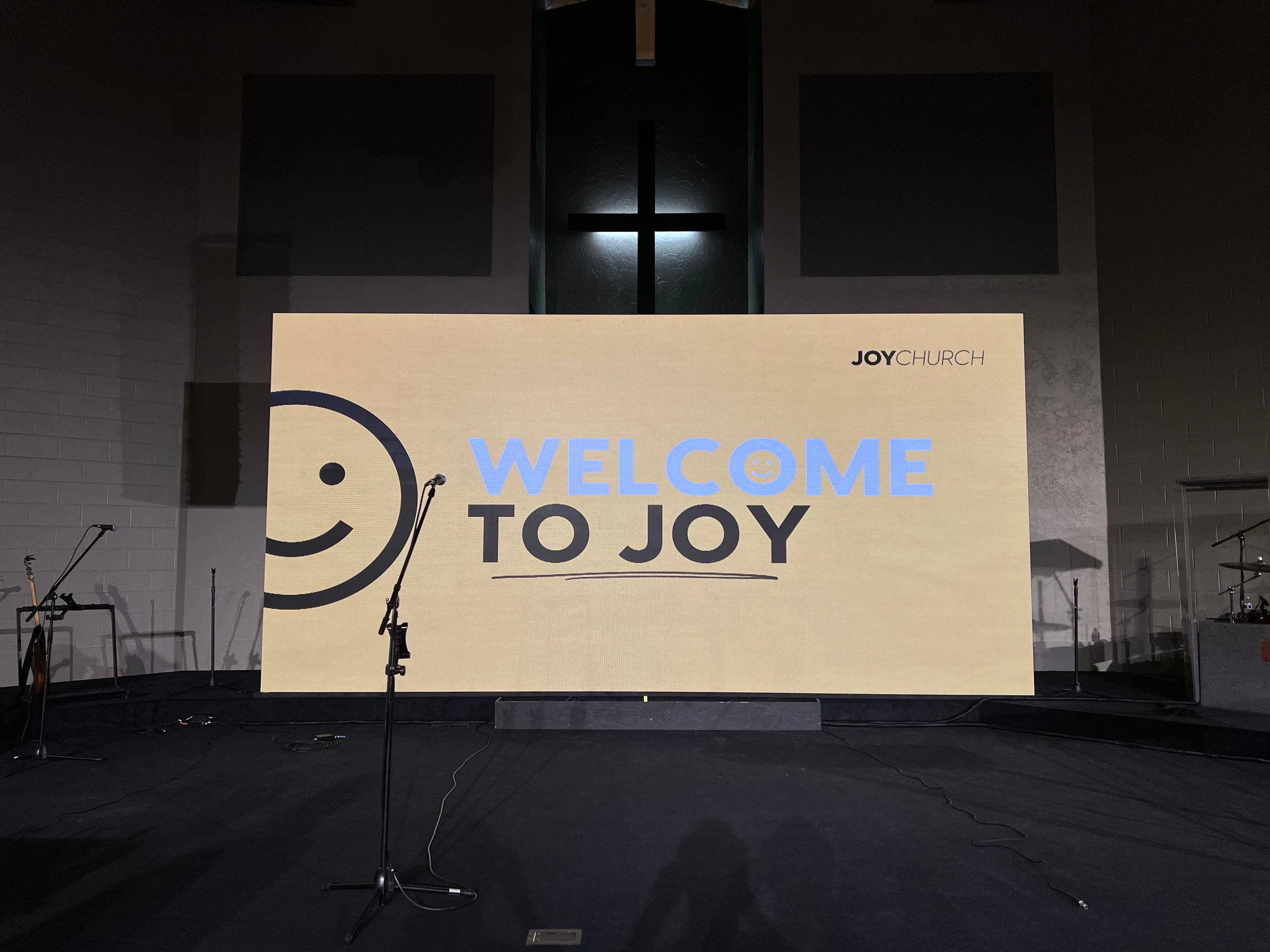 Completed Qohr LED wall centered beneath the cross at Joy Church